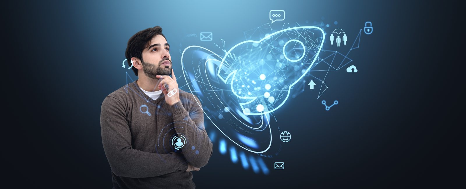 A man contemplates a futuristic holographic rocket surrounded by business icons, on a dark background. Concept of startup growth and innovation