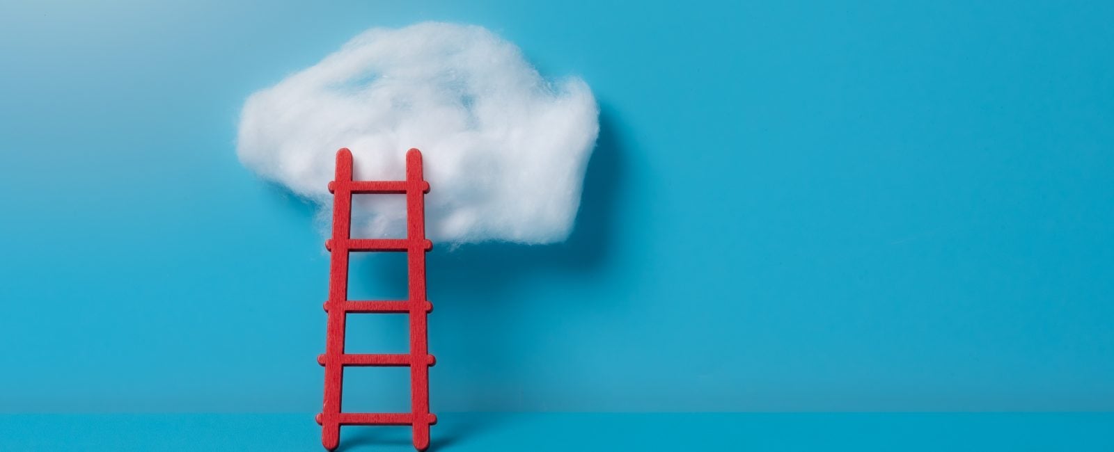 Serene wooden ladder with cloud on blue background