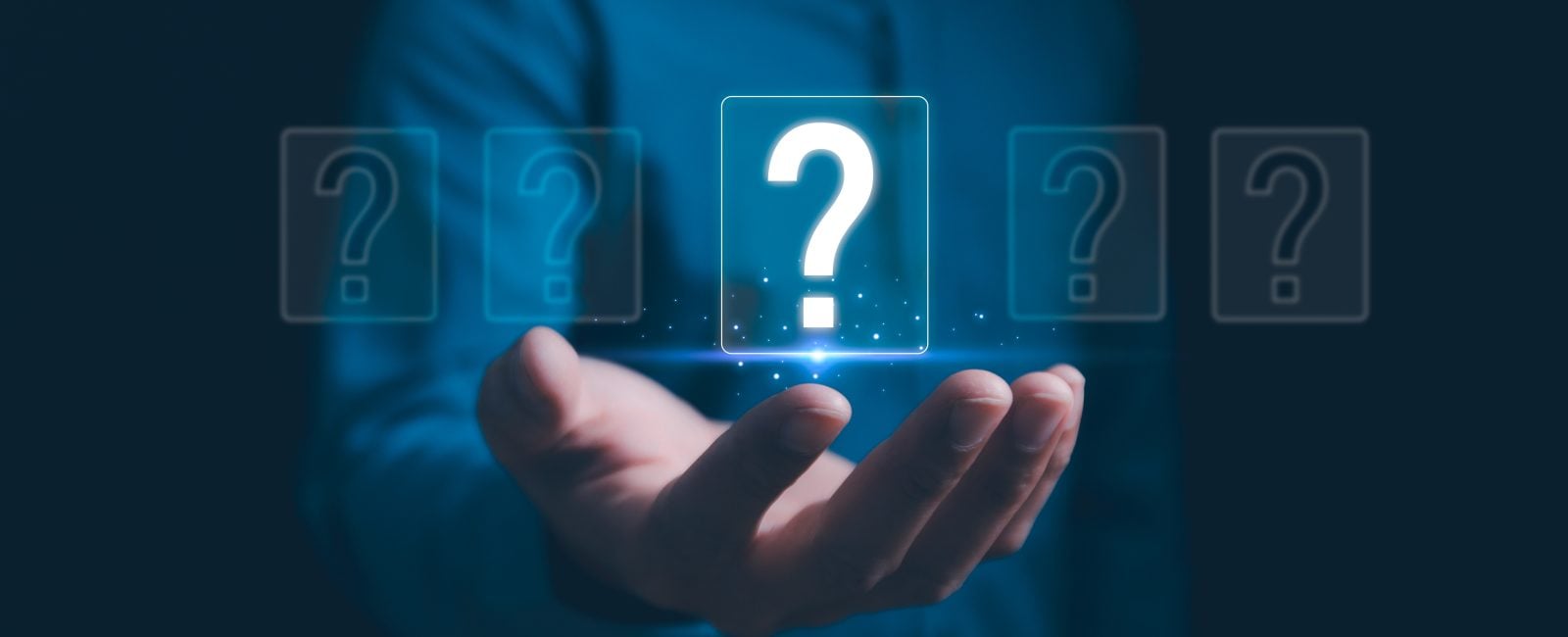 Hands holding FAQ question mark sign. Question Mark and Problem-Solving Concept. Finding answers to business FAQs. Creativity and ideas, asked questions and answers. Brainstorming and problem-solving.