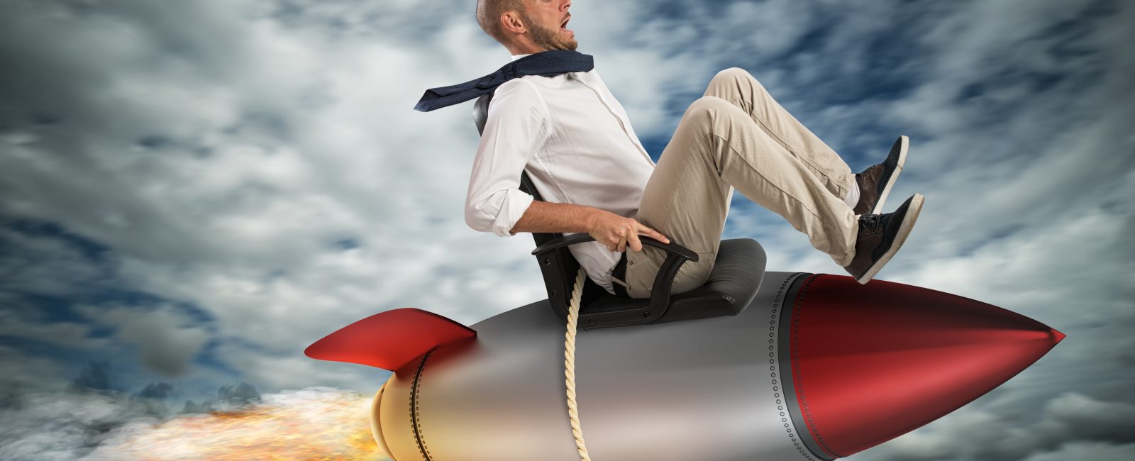 Businessman flying over a rocket in the sky. Increase the climb to success concept