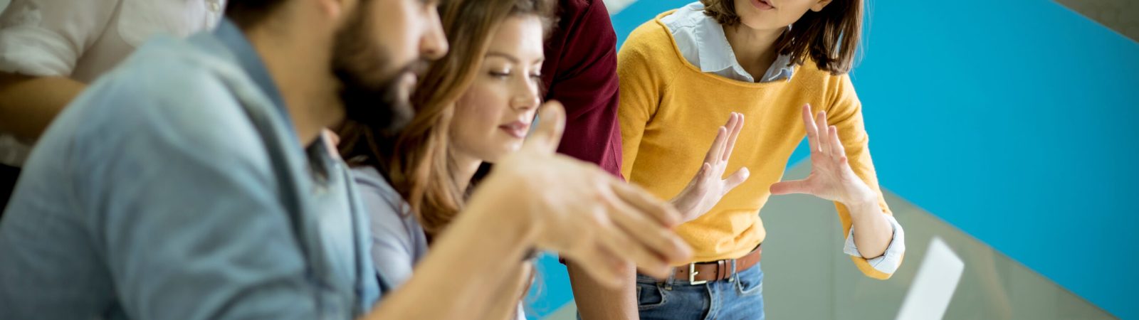 Group of young multiethnic business people working and communicating together in the creative office