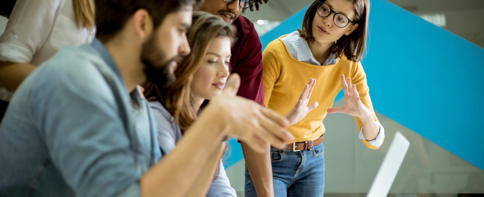 Group of young multiethnic business people working and communicating together in the creative office