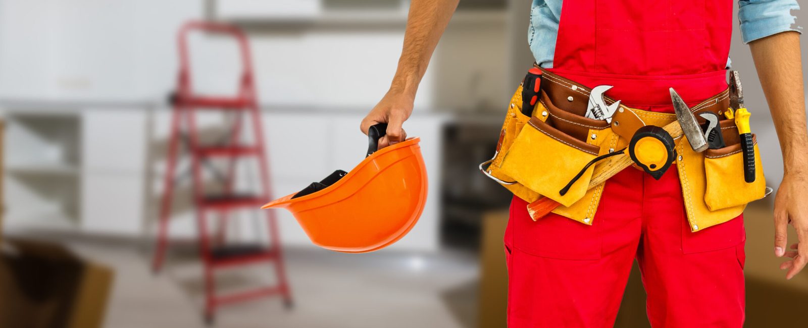 Handyman with a tool belt. House renovation service