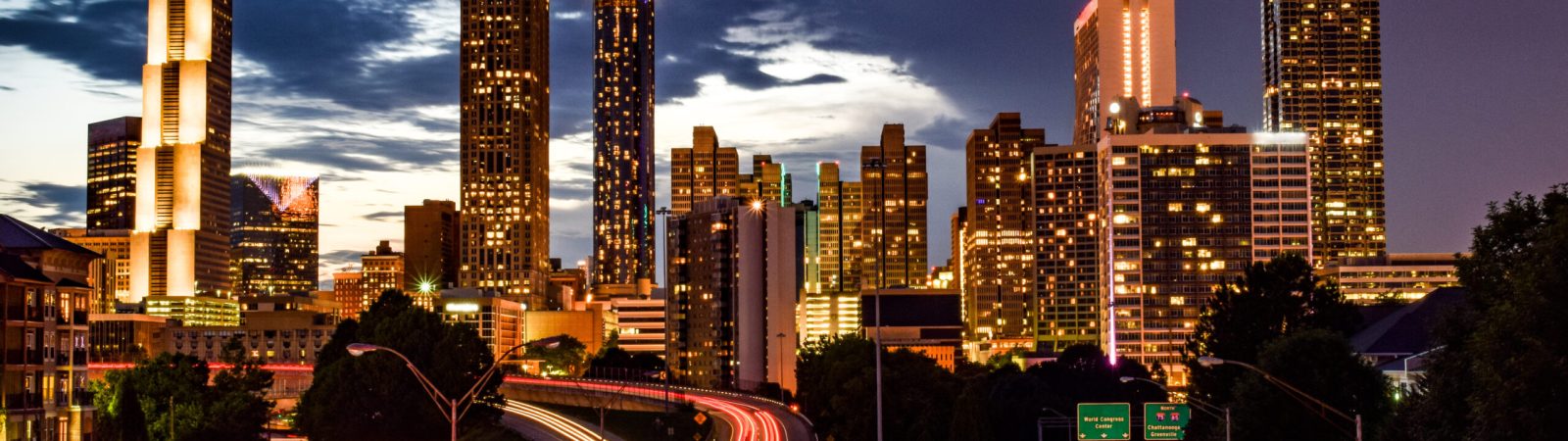 Skyline of Downtown Atlanta and Blurred Highway Traffic at Dusk
