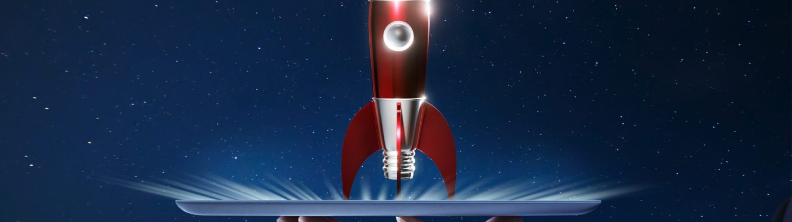 Waiter hand holding an empty digital tablet with Metallic red antique style rocket space ship , Startup creative concept .