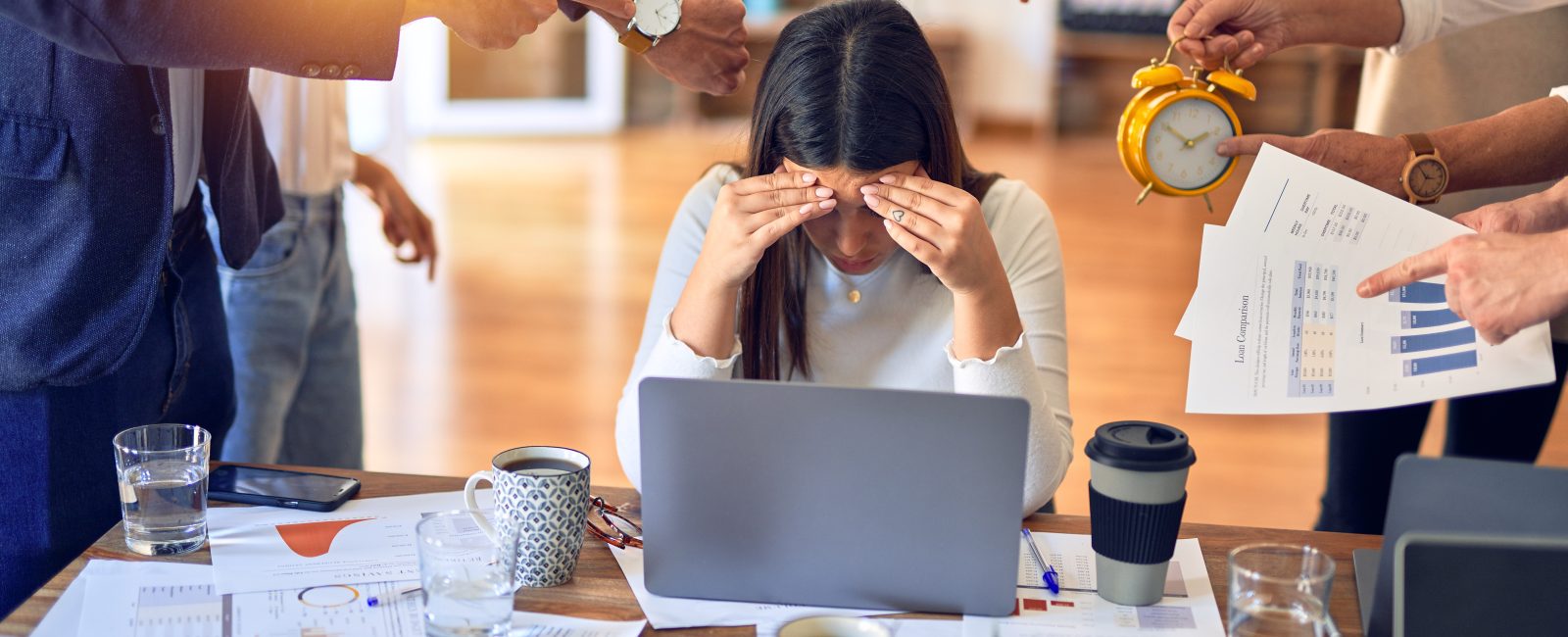 Group of business workers working together. Partners stressing one of them at the office