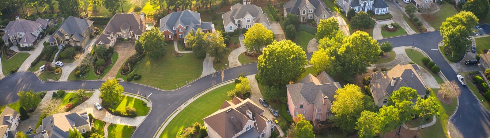 Aerial view of an upscale subdivision in suburbs of a city in USA