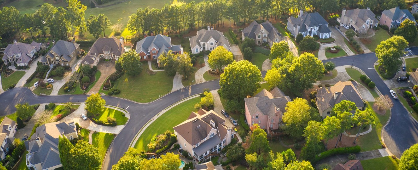Aerial view of an upscale subdivision in suburbs of a city in USA