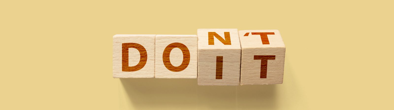 Do it or Don't concept. Wooden cube shape flip change the word