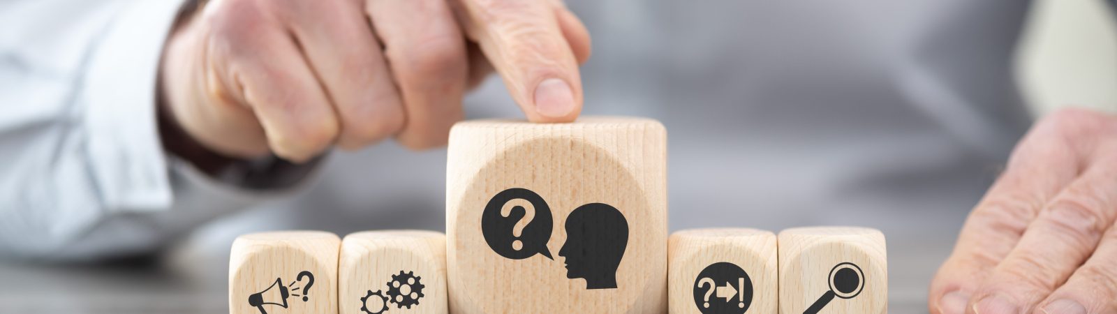 Wooden blocks with symbol of question concept