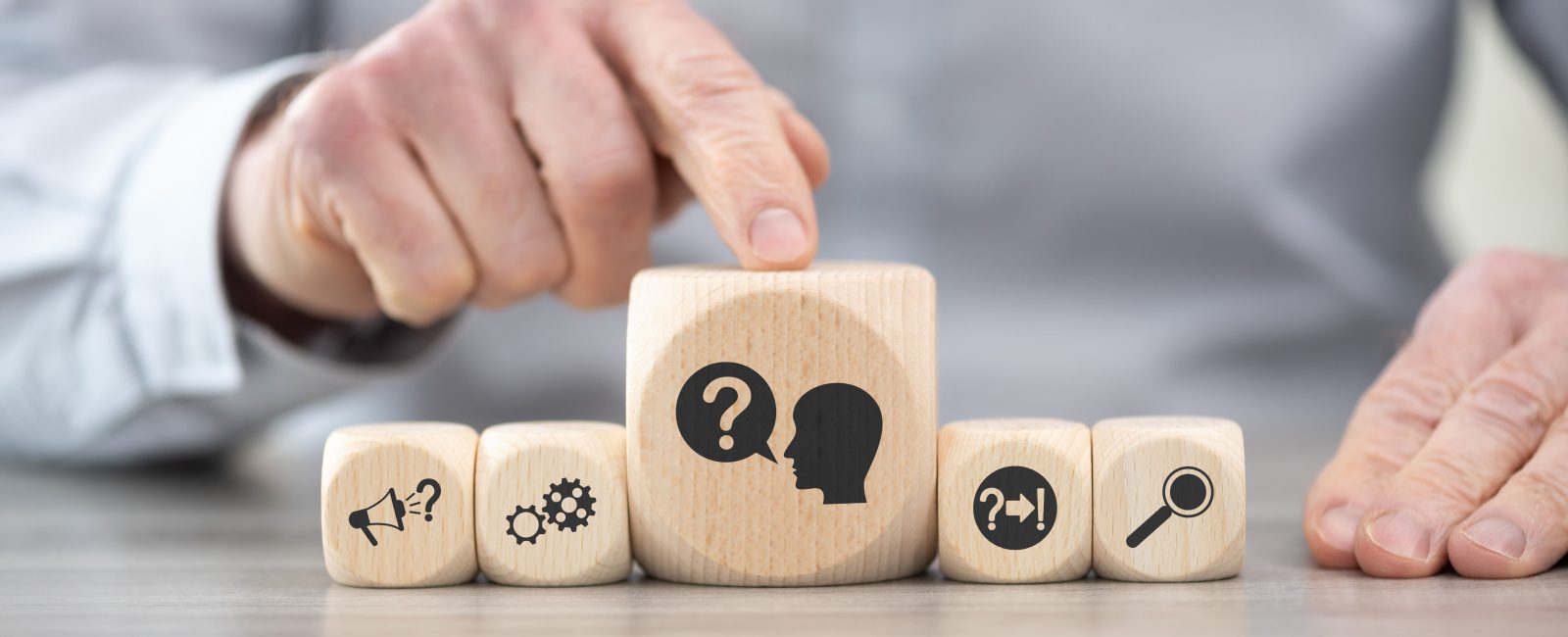 Wooden blocks with symbol of question concept