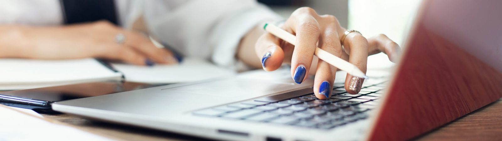 Focus on hand, Young asian woman using computer laptop working at home or cafe. concept people work or study online with new normal