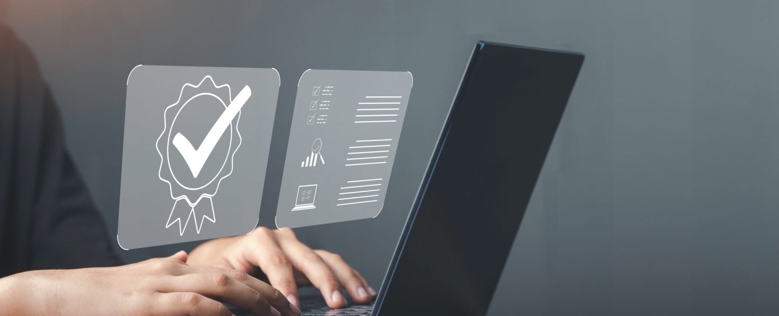 Businessman working on laptop with sign of Quality assurance, Guarantee, ISO certification and standardization. Compliance to regulations and standards, International information security standard.