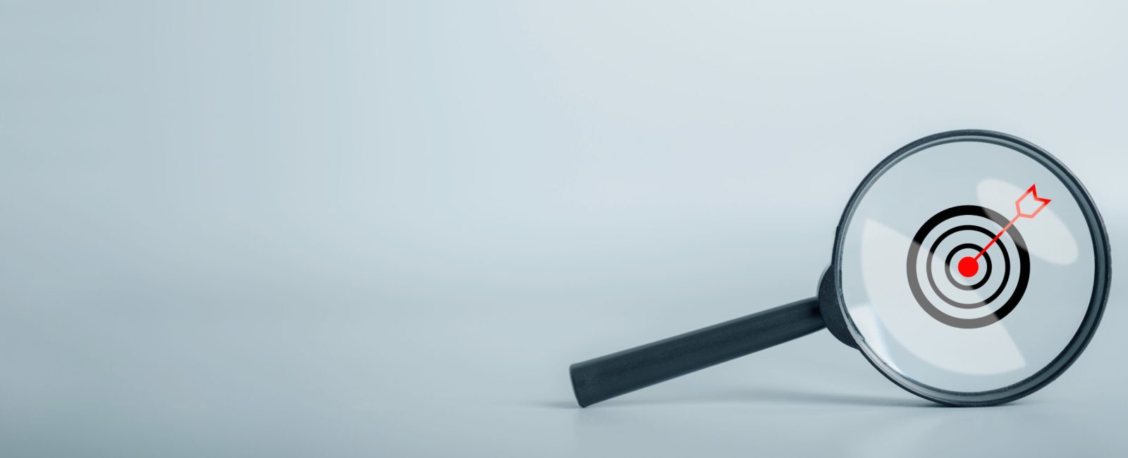 Magnifying glass searching focus to Success and business goal target concept. Project management, company strategy development. copy space for background or text.