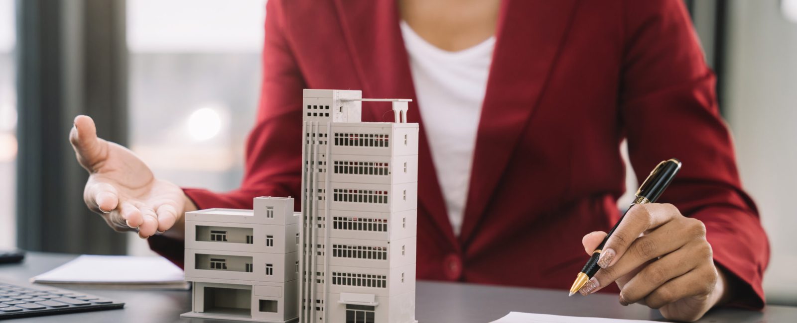 Considering buying a home, investing in real estate. Broker signs a sales agreement. agent, lease agreement, successful deal