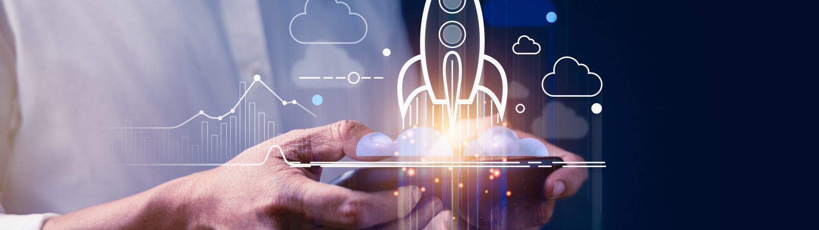 Businessman using smartphone with rising rocket icons on virtual display like a success of business goals target. Business strategy, statistical, analysis and solution management Concept