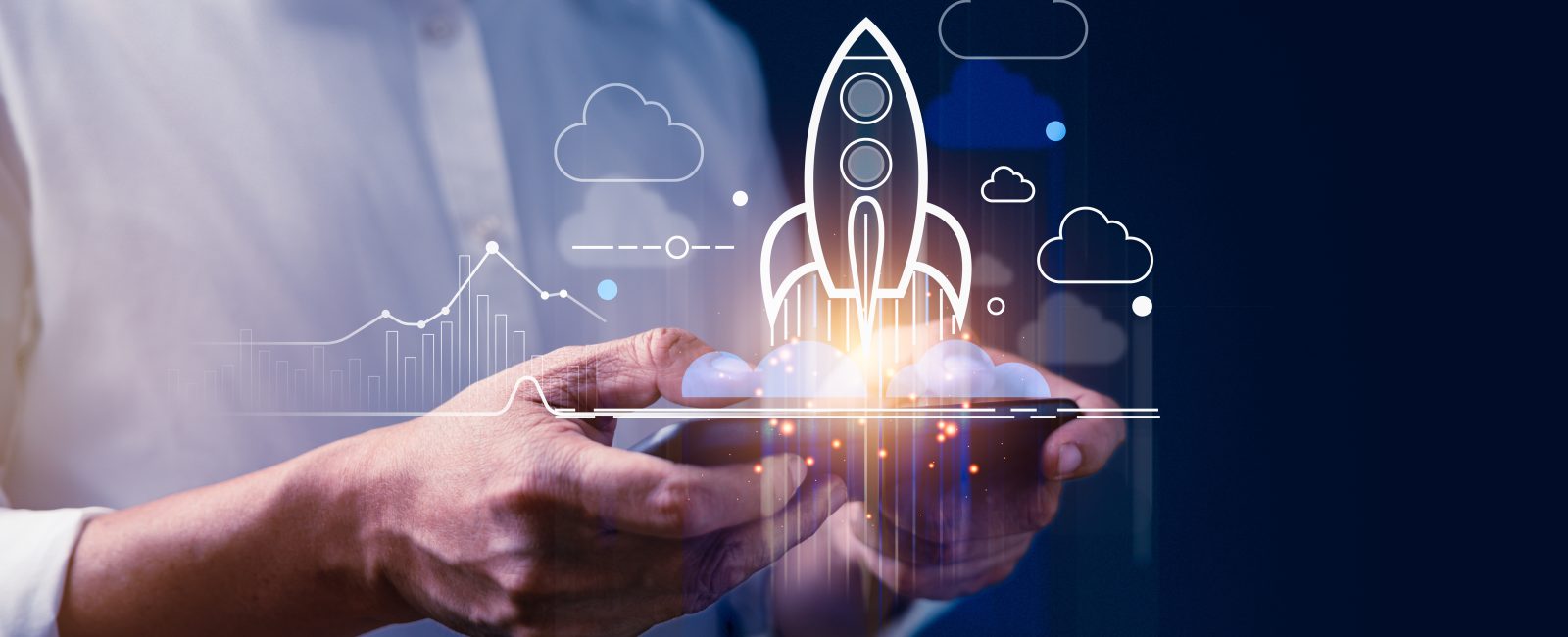 Businessman using smartphone with rising rocket icons on virtual display like a success of business goals target. Business strategy, statistical, analysis and solution management Concept