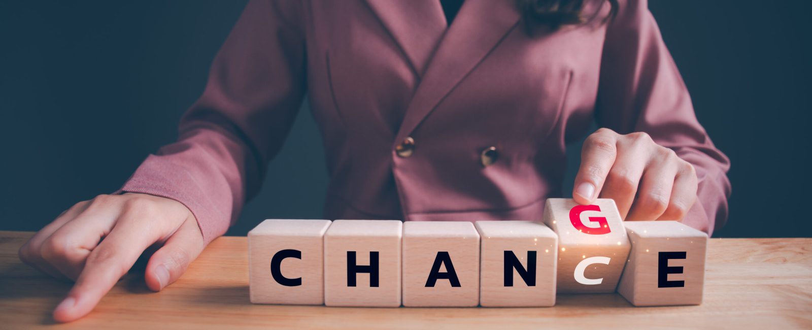 Businesswoman hand flipping wooden blocks with CHANGE to CHANCE text. Economy investment business crisis, technology transformation can make good chance, strategy, solution, positive thinking concept.