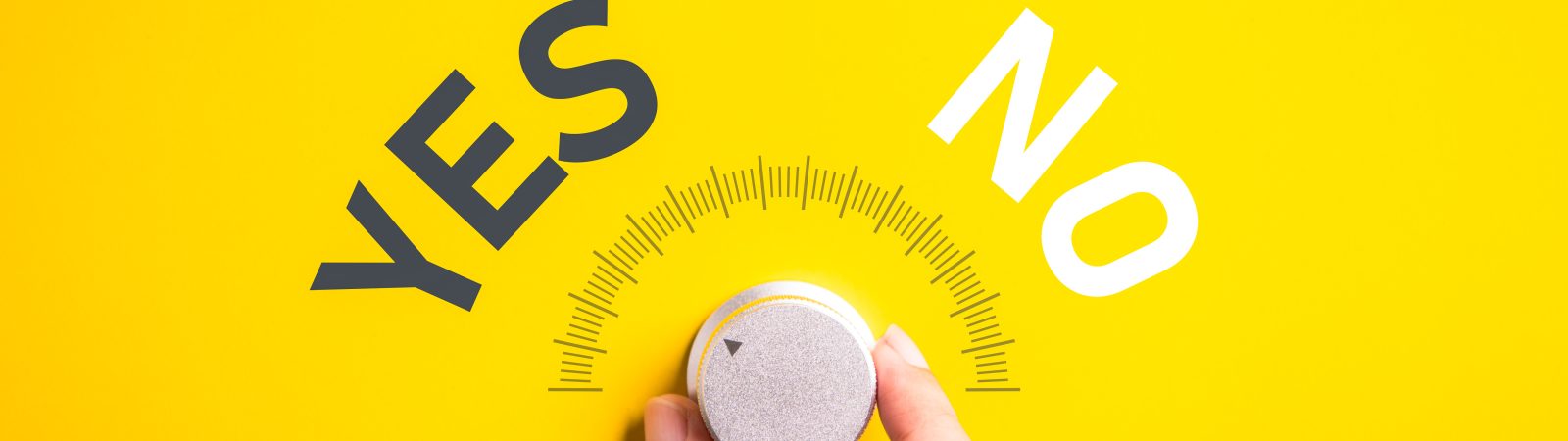 Hand adjusting the volume selector for choosing YES or NO on isolated yellow background. Questionnaire question and answer concept.