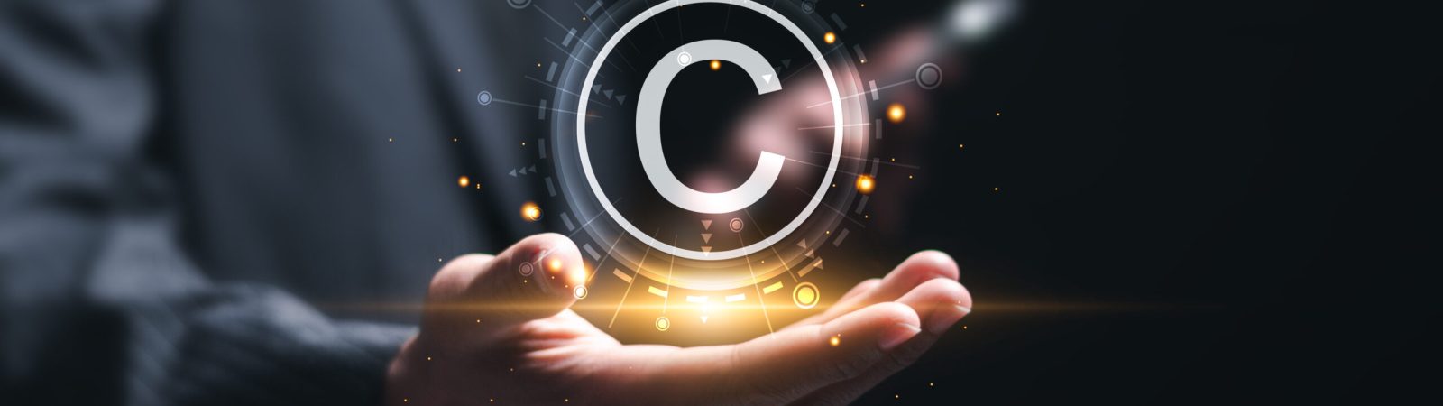 Patented patent copyright law business technology concept. businessman holding virtual  copyright symbol for author rights and patented intellectual property.