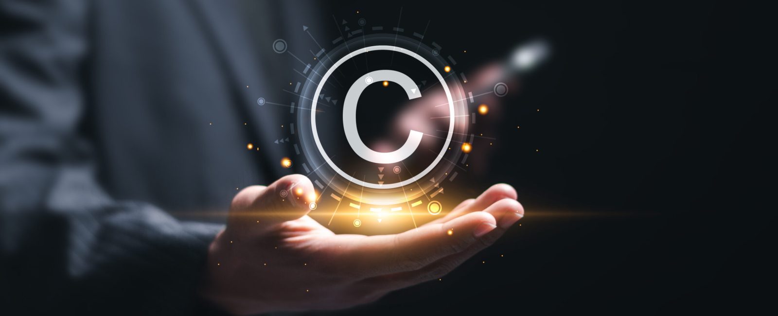 Patented patent copyright law business technology concept. businessman holding virtual  copyright symbol for author rights and patented intellectual property.